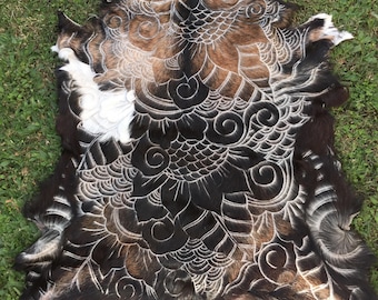 Handcarved goat hide