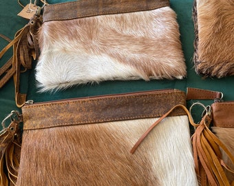 Goathide and leather purses. / clutch.