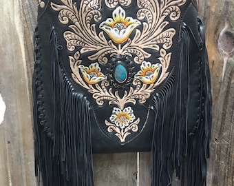 Black leather fringe bag.