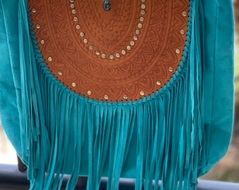 Turquoise suede bag.