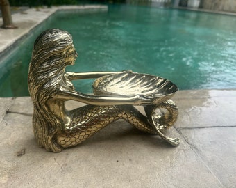 mermaid  holding a shell dish