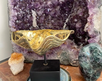 Brass clam shell on stand.
