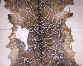 Hand carved goat skin