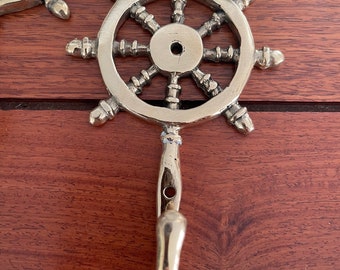 Captains wheel brass hooks.