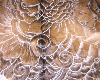 Hand carved goat skin