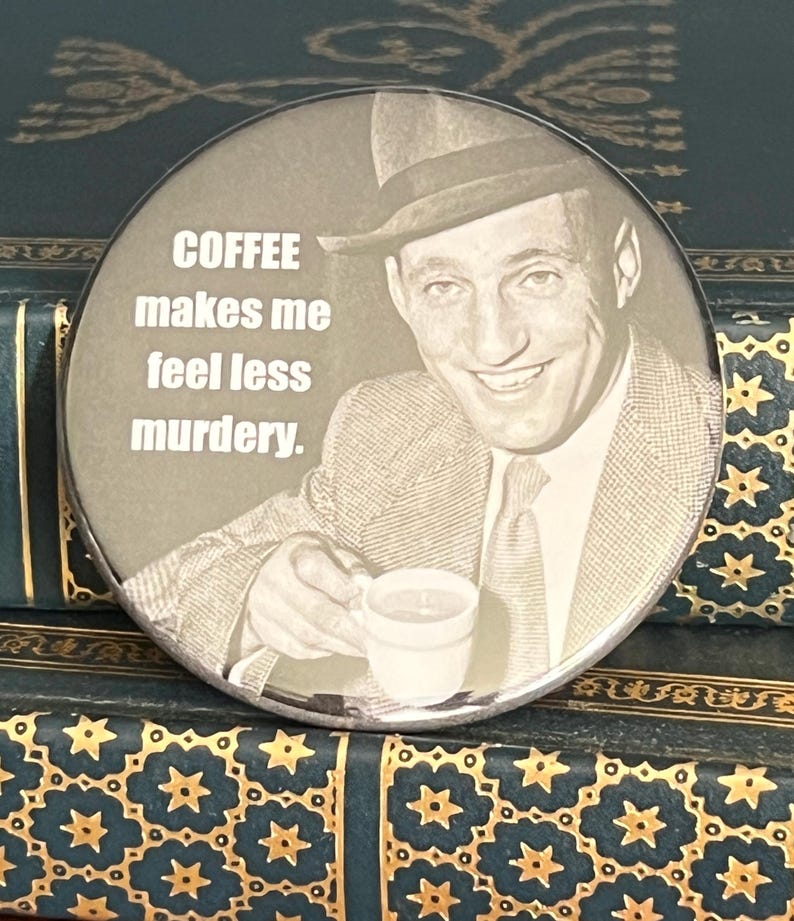 May include: A round, sepia-toned button featuring a smiling man in a fedora holding a coffee cup. The text "COFFEE makes me feel less murdery" is printed in white. The button is set against a background of antique books.