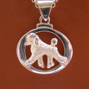 Small Sterling Silver Poodle Moving Study On A Oval Frame Pendant