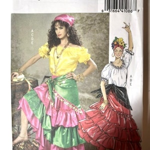 May include: Butterick sewing pattern B4889, size Lrg-Xlg, featuring illustrations of two outfits. One shows a yellow off-the-shoulder top with a green and pink tiered ruffled skirt. The other shows a white blouse with a red tiered ruffled skirt.