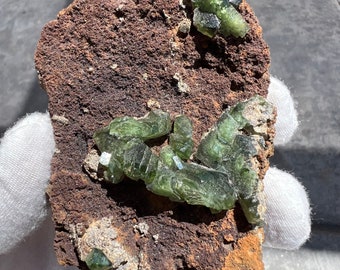 Gemmy Green Ludlamite on a Siderite matrix from São Gabriel da Cachoeira, Brazil. Weird funky elongated crystal clusters. Spherical siderite