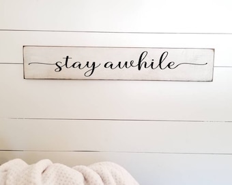 Stay Awhile Wood Sign: Farmhouse Living Room Wall Decor (35" x 5.5")