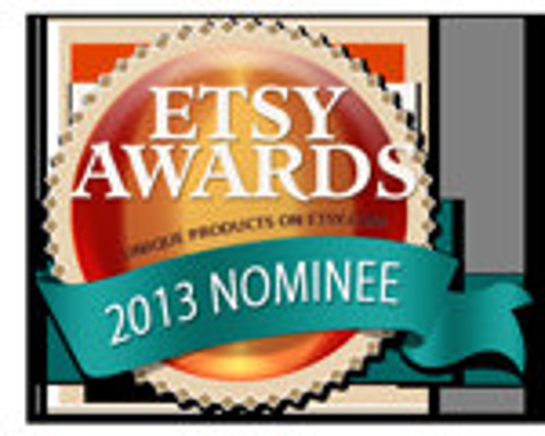 May include: A gold and red Etsy Awards nominee badge with a teal ribbon that says "2013 Nominee".