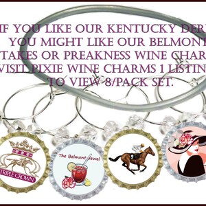 May include: Set of eight silver wine glass charms with colorful bottle cap charms featuring images and text related to the Belmont Stakes horse race. The charms include images of a jockey riding a horse, a woman in a hat, and a horse race logo. The text on the charms includes "Belmont Stakes", "Triple Crown", "The Belmont Jewel", and "Race for the Carnations".