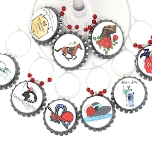 May include: Set of ten silver-colored wine glass charms with red and white designs. The charms feature images of horses, roses, a jockey, a mint julep, and the text "Kentucky Derby" and "Run for the Roses".