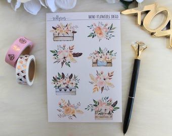 May include: A sheet of stickers with a boho floral theme. The stickers feature various floral arrangements in boxes with a rustic woodgrain finish. The text "boho flowers deco" is printed at the top of the sheet.