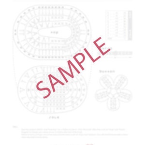May include: A white paper with a detailed diagram of a crochet pattern, featuring oval shapes and a flower-like design. The word "SAMPLE" is printed diagonally across the image in red.