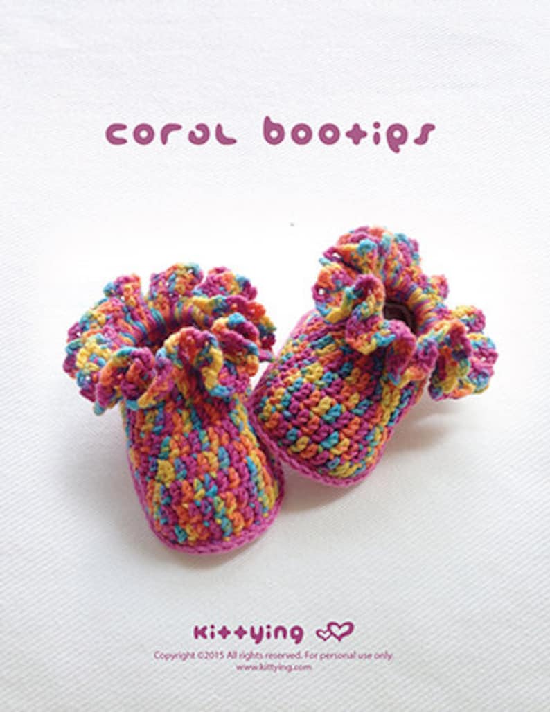 May include: A pair of colorful crocheted baby booties with a ruffled trim. The booties are made in a variety of colors, including pink, yellow, blue, and green. The booties are called "coral bootips" and are made by Kit+ying.