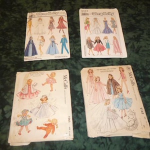 May include: Four vintage sewing patterns for dolls. The patterns are from Simplicity and McCall's. The Simplicity patterns are for dresses and include the numbers 9334 and 9335. The McCall's patterns are for dresses and include the numbers 1945 and 2162.