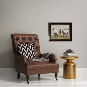 May include: A framed print featuring a watercolour painting of sheep in a field. The print has a gold frame and the text "The LORD is my shepherd; I shall not want." Psalm 23:1.