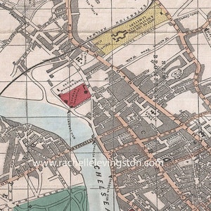 May include: A vintage map of London, England, showing the layout of streets and landmarks. The map is printed in black and white with red and yellow accents. The map includes the names of streets, parks, and other points of interest. The map is titled "London" and is dated 1890.
