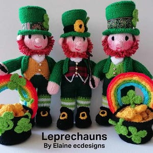 May include: Three knitted leprechaun dolls in green outfits, red beards, and top hats, each holding a rainbow basket filled with gold coins. The dolls are handmade and ideal for St. Patrick's Day.