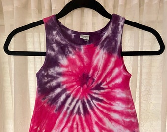May include: A sleeveless tie-dye dress with a pink and purple swirl pattern.