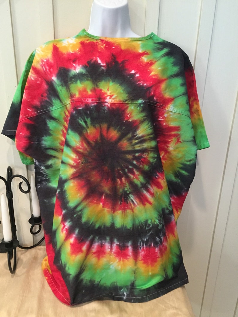 May include: A tie-dye t-shirt with a spiral pattern in shades of red, green, yellow, and black.