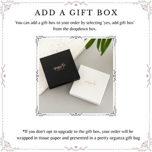 May include: Two gift boxes, one black and one white, with the logo "poppy lo" printed in gold. The text "ADD A GIFT BOX" is at the top of the image. The text below reads "You can add a gift box to your order by selecting 'yes, add gift box' from the dropdown box." The text at the bottom reads "*If you don't opt to upgrade to the gift box, your order will be wrapped in tissue paper and presented in a pretty organza gift bag"