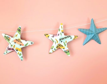 Car decor Baby shower Garland of 9 paper 3D stars of 130cm with print of trucks and cars on a hemp string.