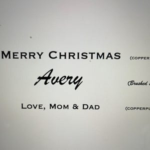 May include: Black text on a light background reads MERRY CHRISTMAS in copperplate font, Avery in a brushed script font, and LOVE, MOM & DAD in copperplate font. Labels to the right indicate (COPPERPLATE) and (Brushed script).