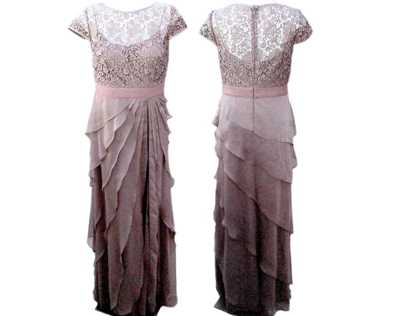 May include: A mauve lace and chiffon dress with a tiered skirt and short sleeves.
