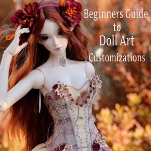 May include: A doll with long red hair and a floral headpiece, wearing a detailed corset and a cream-colored dress. The image includes the text "Beginners Guide to Doll Art Customizations". The doll is posed in front of a blurred autumn background.