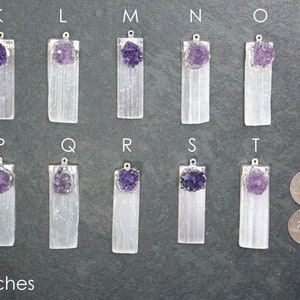 May include: Ten selenite crystal pendants with amethyst clusters, labeled K through T. Each pendant is approximately 1.5 inches long and features a silver bail.