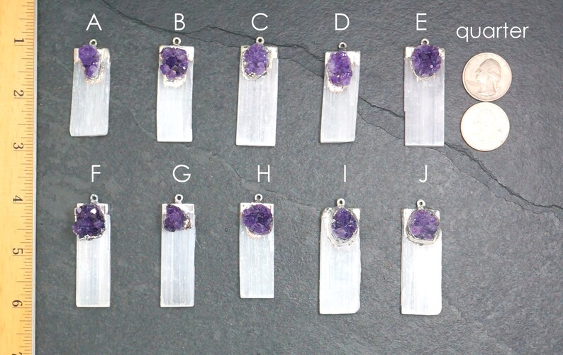 May include: Ten selenite crystal pendants with amethyst clusters, each labeled with a letter from A to J. A US quarter is included for scale.