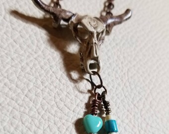 Southwest inspired hand painted cow skull charm and beads.