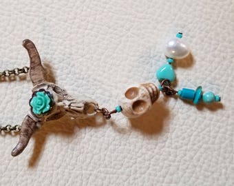 Southwest inspired hand painted cow skull charm with Turquoise and pearl.