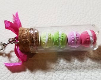 Hand made mini macarons in glass vial.