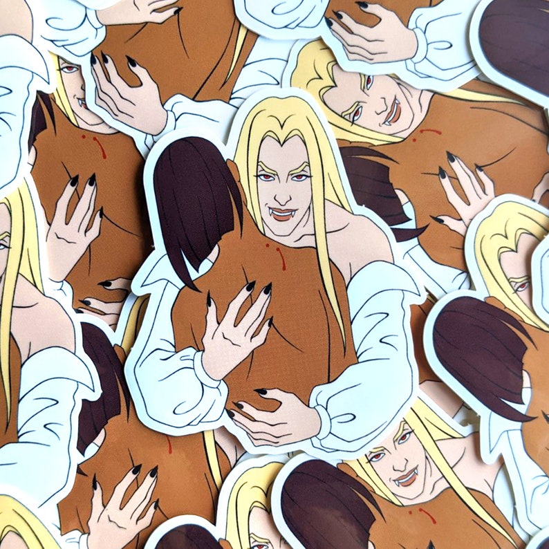 May include: A set of colorful stickers featuring a vampire couple embracing. The stickers are printed on white paper and have a glossy finish.