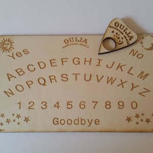 Mini travel ouija board with planchette