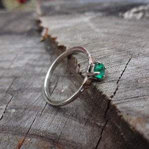 Emerald engagement ring in gold and silver