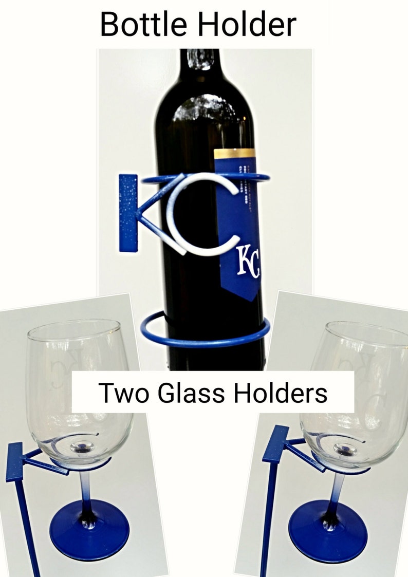 May include: A blue metal wine bottle holder with the letters "KC" in white. Two matching blue metal glass holders are also included.