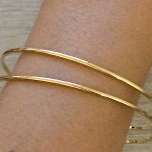 Delicate gold best sale bangles