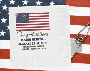 May include: White paper napkin with a red, white, and blue American flag design. The text "Congratulations Major General Alexander M. Bush Your Military Branch Retired - August 12, 2025" is printed on the napkin.