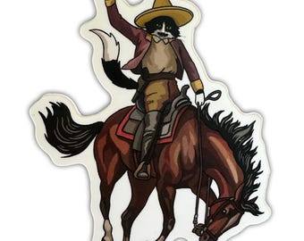 May include: A sticker featuring a cat dressed as a cowboy riding a brown horse. The cat wears a yellow hat, a maroon jacket, and brown pants. The horse has a red saddle blanket. The cat raises its right arm in a salute.