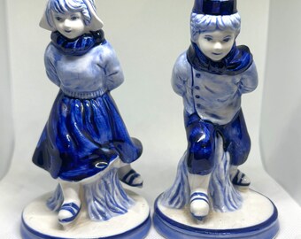 Vintage Pair of Delft Blue Hand Painted Boy and Girl Skating Figurines. 5.5 - 6 inches tall. Beautiful condition.