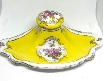 Vintage Porcelain unmarked China Inkwell gold trim yellow with roses. Has original lid.
