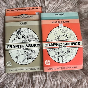 May include: A collection of vintage "Graphic Source Clip Art" books. Titles include "Art Nouveau Borders & Frames", "Floral Ornaments", "Sports", "Holidays", and "Splashes & Bursts". The books have a beige and coral color scheme with illustrations.