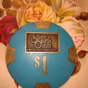 Silver smith casino resort Wendover Nevada one dollar token detailed inlay well used