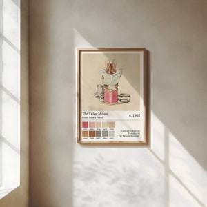 May include: A framed print of "The Tailor Mouse" by Helen Beatrix Potter. The illustration shows a mouse reading atop a spool of pink thread, with scissors and a thimble. The print includes colour swatches and text, all within a wooden frame.