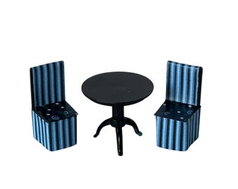 May include: A black and blue striped dining set with two chairs and a round table.