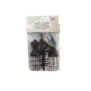 May include: A package of two black plastic miniature dress forms with cage-style skirts and matching stands. The header card features the text CHRYSNBON MINIATURE PRODUCTS and a small American flag icon with the text MADE IN U.S.A. at the top.